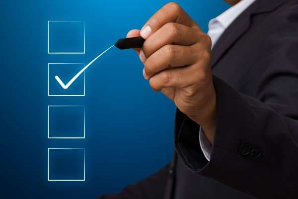 A man checking boxes on the screen